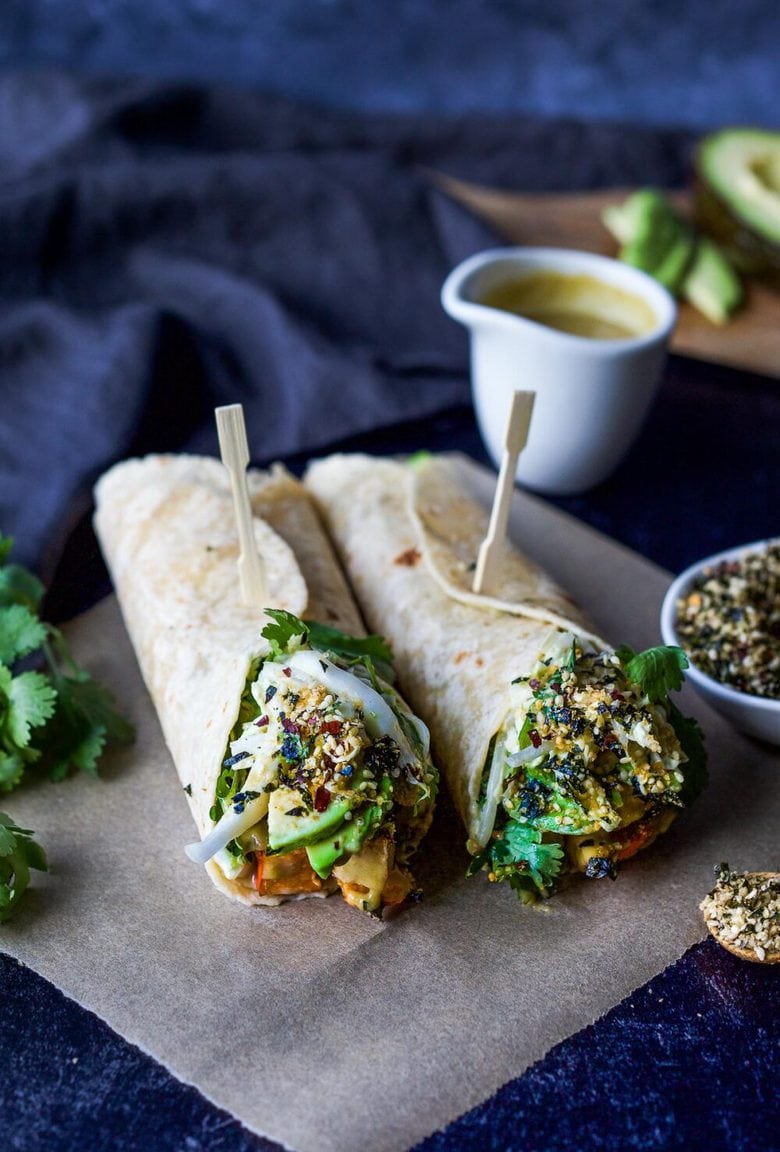 A delicious vegan recipe for Miso Tofu Wrap with Roasted Winter Squash, Baked Miso Tofu, Asian Slaw, Avocado, Furikake and flavorful Miso Dressing. #veganwrap #wrap #tofu