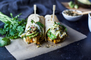 A delicious vegan recipe for Miso Tofu Wrap with Roasted Winter Squash, Baked Miso Tofu, Asian Slaw, Avocado, Furikake and flavorful Miso Dressing. #veganwrap #wrap #tofu