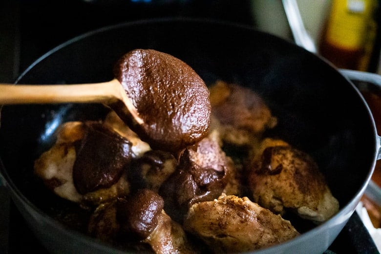 add the mole negro sauce and bake