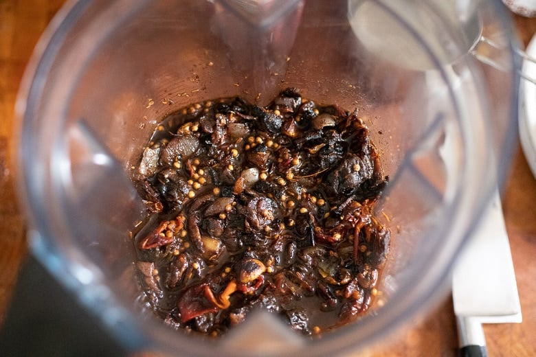 place chilies and onions in a blender with the cooking liquid