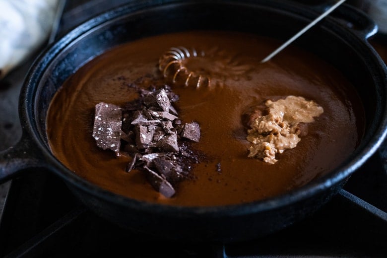 Place the sauce back in the pan, add chocolate and peanut butter