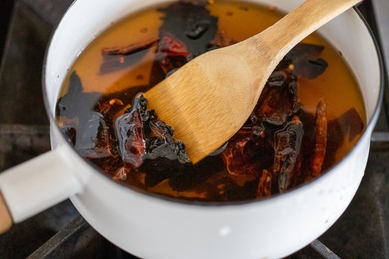 simmer chilies in broth