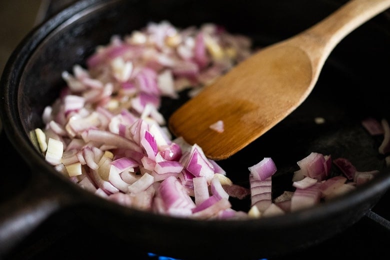 onion and garlic sautéing in pan