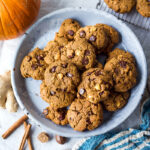 One-bowl Vegan Pumpkin Cookies with hazelnuts and chocolate chips are lightly sweetened with coconut sugar and accented with fresh ginger.  These cookies are healthy, delicious, gluten-free and can be made in 30 minutes!