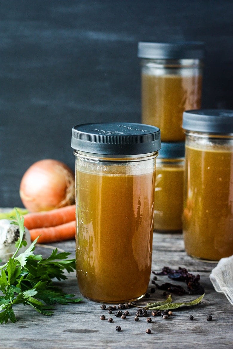 Jars of homemade vegetable stock.