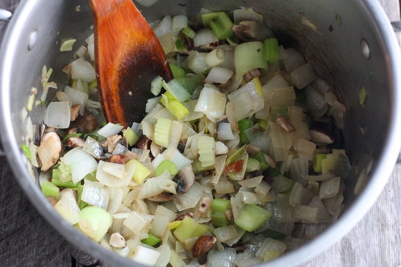 sauteing vegetables in pot 