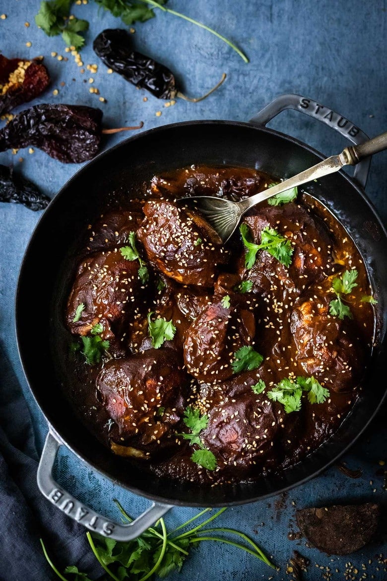 A flavorful recipe for Chicken Mole Negro is made with Black Mole Sauce- smoky, spicy and nutty with dried chilies, and a hint of chocolate. A flavorful Oaxacan-inspired meal. #mole #molenegro 