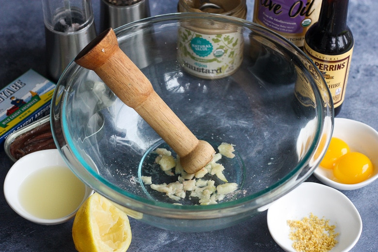 smashing garlic with salt