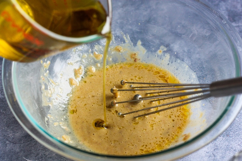 whisking in olive oil