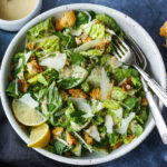 How to make a classic Caesar salad with homeade creamy Caesar dressing, parmesan cheese and homemade croutons. #caesar
