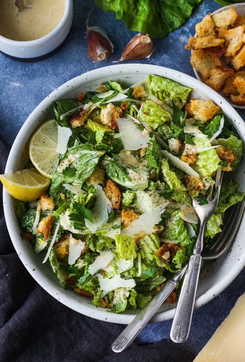 How to make a classic Caesar Salad with homemade Caesar dressing, parmesan cheese and hand-torn croutons.