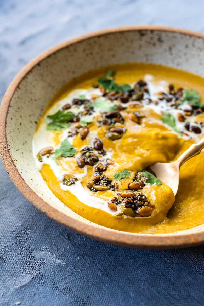 Thick and creamy Pumpkin soup with coconut milk, and warming Indian spices. Vegan and Gluten-free. Use roasted pumpkin or canned pumpkin puree!