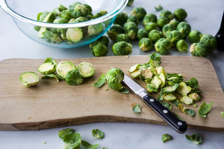 trimming and slicing Brussel sprouts in half