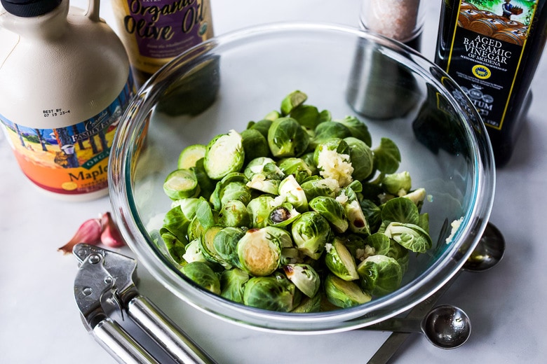tossing brussel sprouts with seasonings