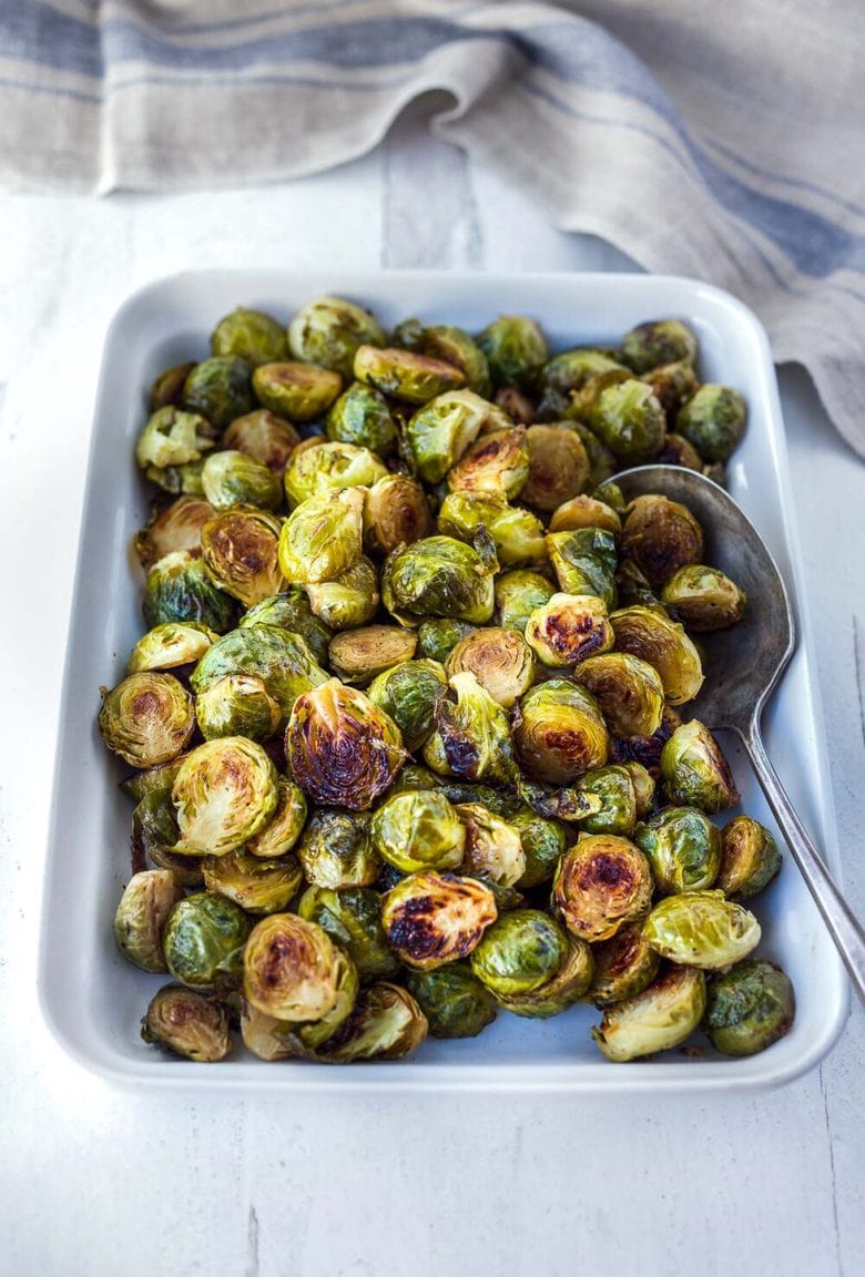 A simple recipe for Roasted Brussel Sprouts with garlic and balsamic- tender, carmelized and full of toasty deep flavor.  An easy vegan side dish ready in 30 minutes! 