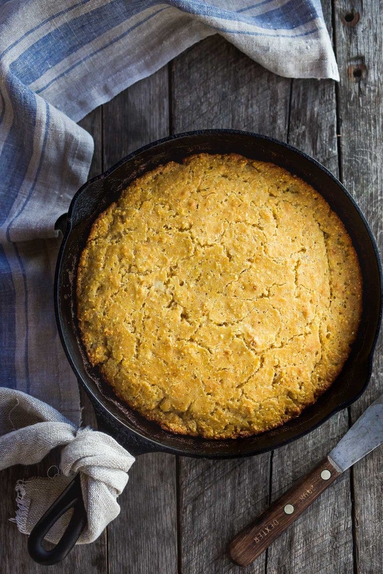 This Cornbread recipe is homey, delicious, and full of wholesome cornmeal flavor with an irresistible crusty edge.  Bake it in a skillet or baking dish and it's ready in just 35 minutes! Perfect for serving with soups, chili's, stews. Vegan-Adaptable (see recipe notes!). 