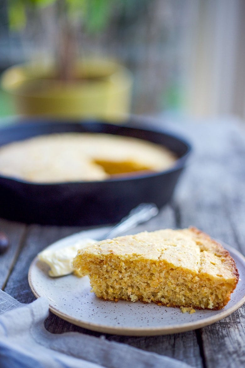 This Cornbread recipe is homey, delicious, and full of wholesome cornmeal flavor with an irresistible crusty edge.  Bake it in a skillet or baking dish and it's ready in just 35 minutes! Perfect for serving with soups, chili's, stews. Vegan-Adaptable (see recipe notes!). 