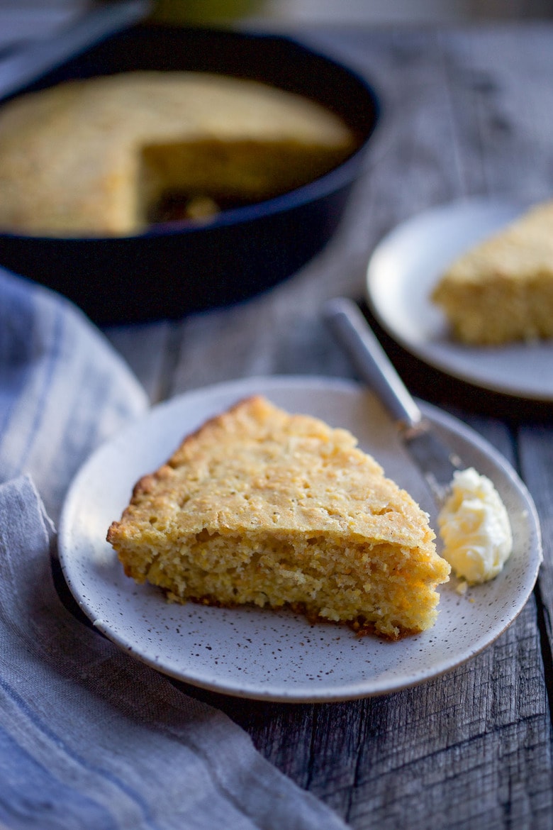 This Cornbread recipe is homey, delicious, and full of wholesome cornmeal flavor with an irresistible crusty edge.  Bake it in a skillet or baking dish and it's ready in just 35 minutes! Perfect for serving with soups, chili's, stews. Vegan-Adaptable (see recipe notes!). 