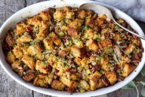 Vegetarian Cornbread Stuffing with Fennel Bulb, Dried Cranberries, and Toasted Pecans is richly flavored and soul comforting.  The perfect addition to your holiday table.  This recipe can easily be made a day ahead of baking!  Vegetarian and Gluten Free adaptable.