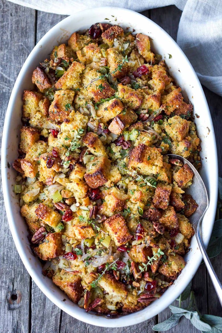 Vegetarian Cornbread Stuffing with Fennel Bulb, Dried Cranberries, and Toasted Pecans is richly flavored and so delicious!  The perfect addition to your holiday table.  This recipe can easily be made a day ahead of baking.  Vegetarian and Gluten-Free adaptable.