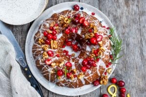 Vegan Cranberry Cake scented with orange and toasty walnuts has a light and tender crumb with just the right balance of sweet and tart.  Festive and delicious, a perfect holiday dessert!