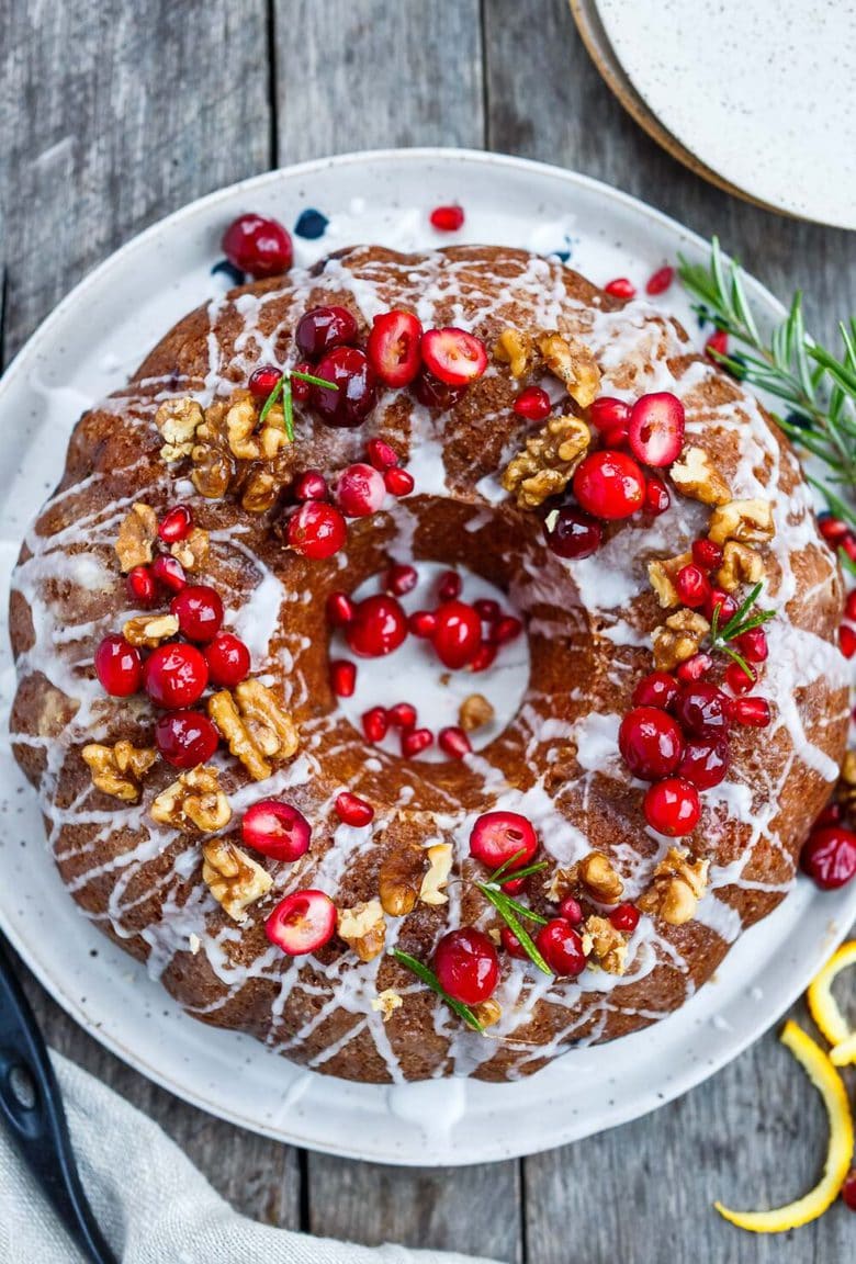 Vegan Cranberry Cake scented with orange and toasty walnuts has a light and tender crumb with just the right balance of sweet and tart.  Festive and delicious, a perfect holiday dessert!