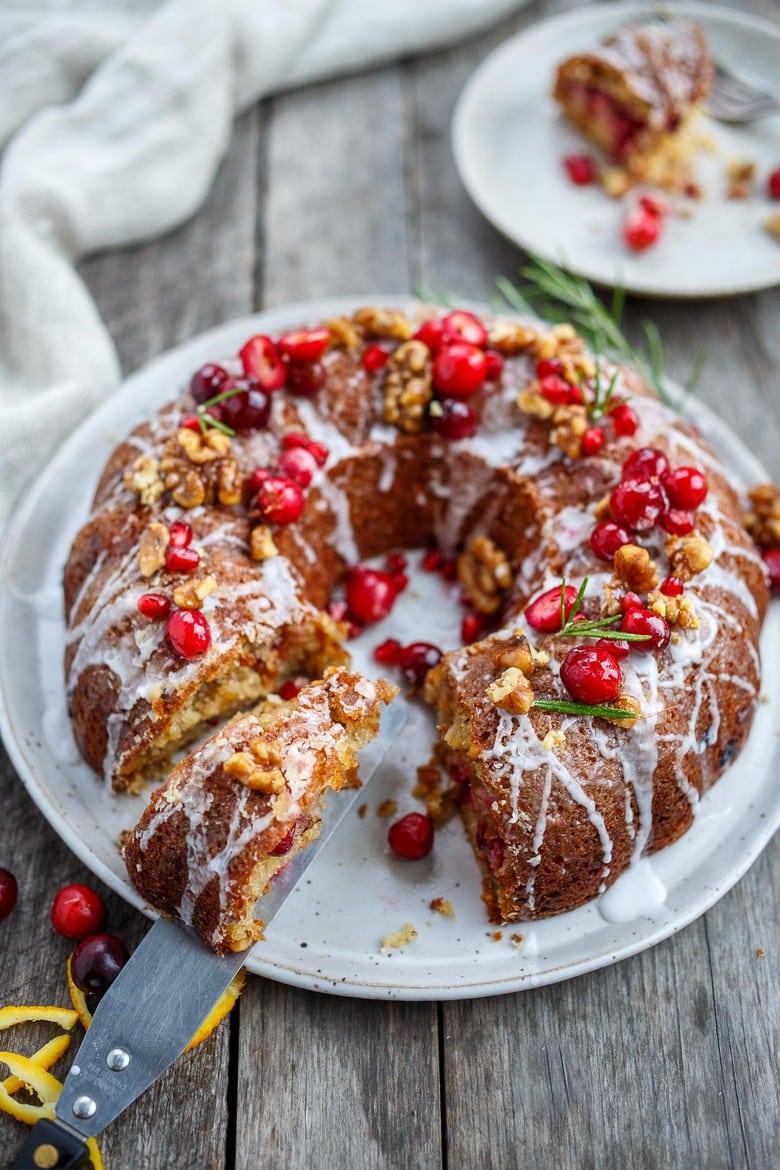 Vegan Cranberry Cake scented with orange and toasty walnuts has a light and tender crumb with just the right balance of sweet and tart.  Festive and delicious, a perfect holiday dessert!