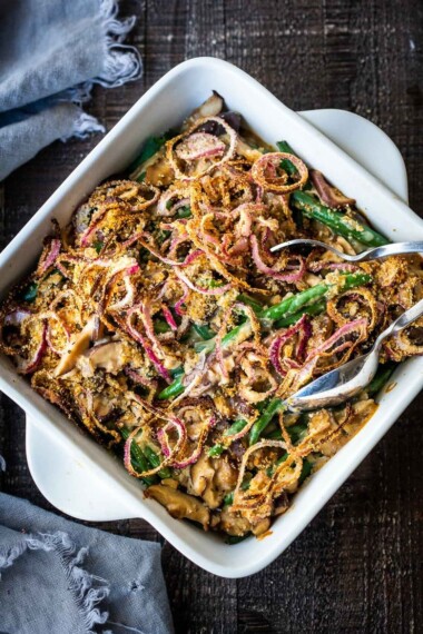 This healthy Green Bean Casserole is made with fresh green beans, oven-baked crispy shallots, and a creamy mushroom sauce that is VEGAN! Easy, healthy and delicious, worthy of the holiday table. 