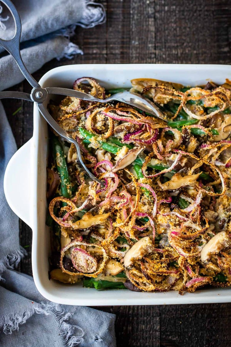 This healthy Green Bean Casserole is made with fresh green beans, oven-baked crispy shallots, and a creamy mushroom sauce that is VEGAN! Easy, healthy and delicious, worthy of the holiday table. 
