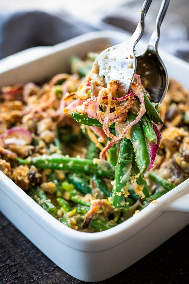 This healthy Green Bean Casserole is made with fresh green beans, oven-baked crispy shallots, and a creamy mushroom sauce that is VEGAN! Easy, healthy and delicious, worthy of the holiday table. 