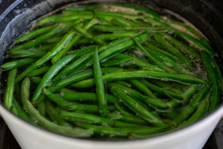 blanch the green beans in salted boiling water