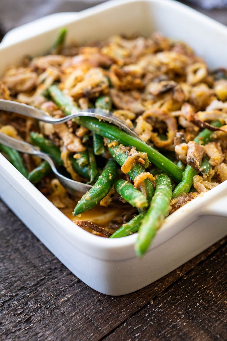 This healthy Green Bean Casserole is made with fresh green beans, oven-baked crispy shallots, and a creamy mushroom sauce that is VEGAN! Easy, healthy and delicious, worthy of the holiday table. 