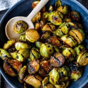A simple recipe for Roasted Brussels Sprouts with garlic and balsamic- tender, carmelized and full of toasty deep flavor.  An easy vegan side dish ready in 30 minutes! 