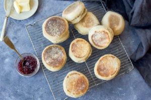 How to make homemade Sourdough English Muffins using sourdough starter (no yeast!).  They raise overnight and are cooked on the stovetop in the morning.   Tender, delicious and easier to make than you might think!  Vegan adaptable.