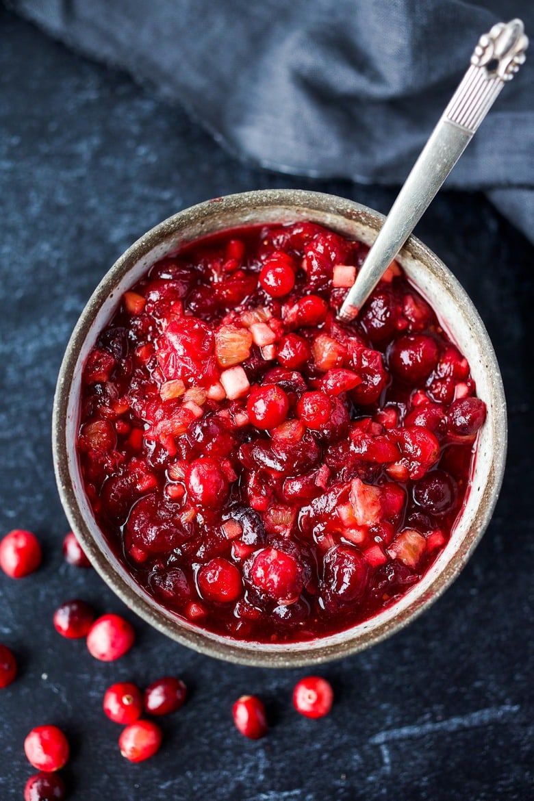 Orange Maple Cranberry Sauce with fresh apple is a bright and healthy addition to your holiday feast!  Easy, fast, and can be made ahead.   Maple-sweetened, and free of refined sugar, vegan and gluten-free!
