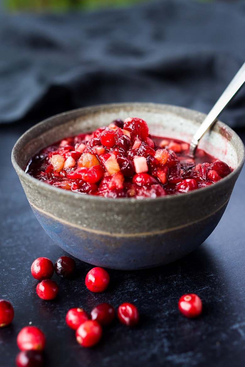 Orange Maple Cranberry Sauce with fresh apple is a bright and healthy addition to your holiday feast!  Easy, fast, and can be made ahead.   Maple-sweetened, and free of refined sugar, vegan and gluten-free! #cranberrysauce