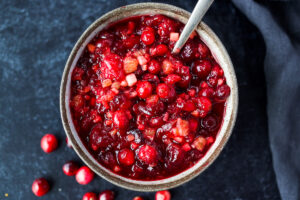 Orange Maple Cranberry Sauce with fresh apple is a bright and healthy addition to your holiday feast!  Easy, fast, and can be made ahead.   Maple-sweetened, and free of refined sugar, vegan and gluten-free! #cranberrysauce