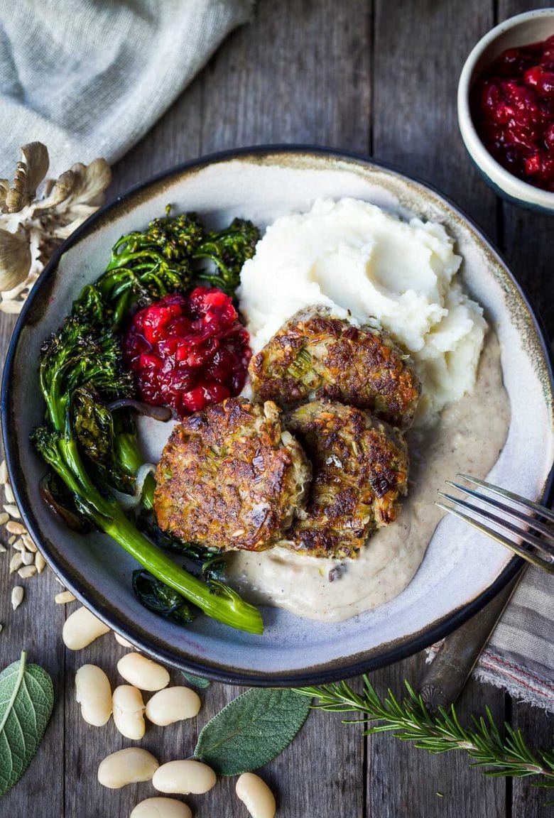 Sagey Leek and White Bean Patties are brimming with all the savory holiday flavors!  Perfect for making ahead time.  Serve them up with mashed potatoes, cranberry sauce and mushroom gravy for a satisfying vegan feast!  Gluten-free adaptable.