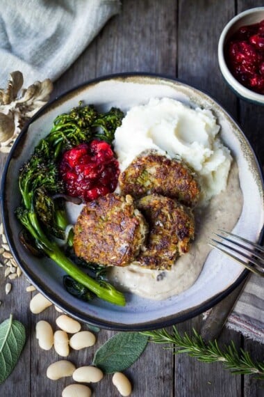 Sagey Leek and White Bean Patties are brimming with all the savory holiday flavors!  Perfect for making ahead time.  Serve them up with mashed potatoes, cranberry sauce and mushroom gravy for a satisfying vegan feast!  Gluten-free adaptable.