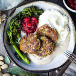 Sagey Leek and White Bean Patties are brimming with all the savory holiday flavors! Perfect for making ahead time. Serve them up with mashed potatoes, cranberry sauce and mushroom gravy for a satisfying vegan feast! Gluten-free adaptable.