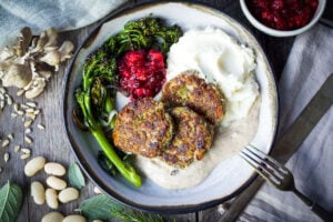 Sagey Leek and White Bean Patties are brimming with all the savory holiday flavors!  Perfect for making ahead time.  Serve them up with mashed potatoes, cranberry sauce and mushroom gravy for a satisfying vegan feast!  Gluten-free adaptable.