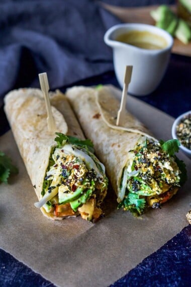 A delicious vegan recipe for Miso Tofu Wrap with Roasted Winter Squash, Baked Miso Tofu, Asian Slaw, Avocado, Furikake and flavorful Miso Dressing. #veganwrap #wrap #tofu