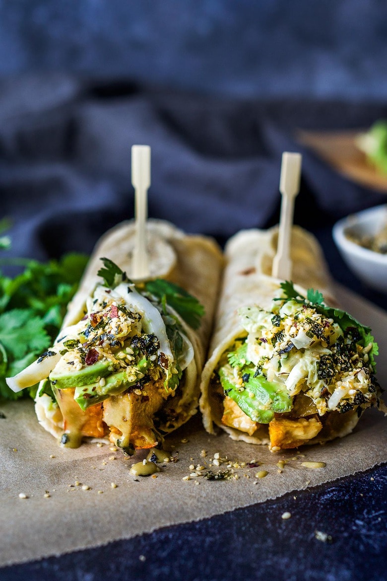 A delicious vegan recipe for Miso Tofu Wrap with Roasted Winter Squash, Baked Miso Tofu, Asian Slaw, Avocado, Furikake and flavorful Miso Dressing. #veganwrap #wrap #tofu