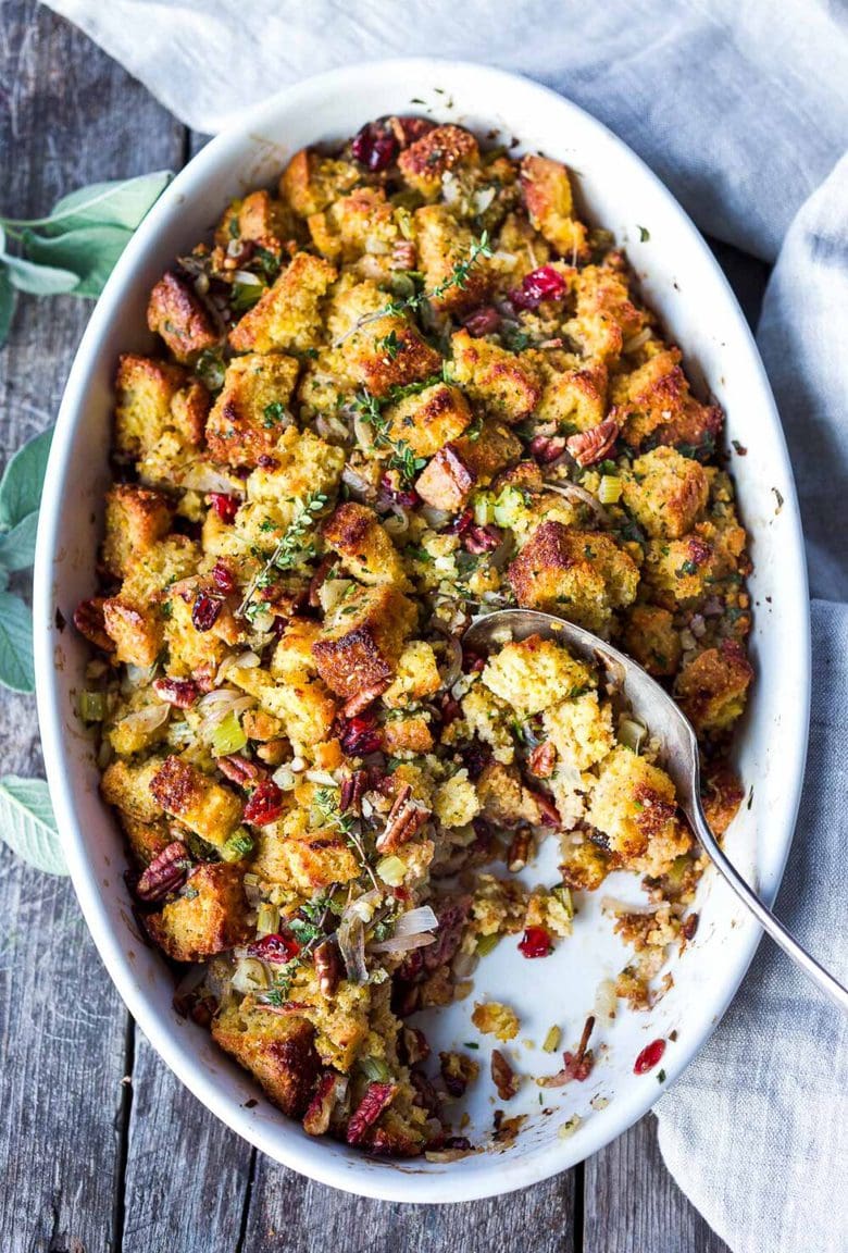 Cornbread Stuffing with Fennel Bulb, Dried Cranberries, and Toasted Pecans is richly flavored and so delicious!  The perfect addition to your holiday table.  This recipe can easily be made a day ahead of baking.  Vegetarian and Gluten-Free adaptable.