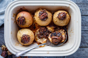 Healthy and delectable Baked Apples with Maple Syrup are filled with spiced toasty nuts, dates and dried cherries.  Serve for dessert or brunch.  No refined sugar, vegan and gluten-free!  