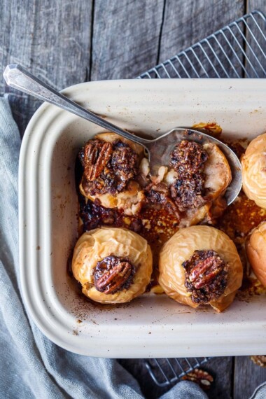 Healthy and delectable Baked Apples with Maple Syrup are filled with spiced toasty nuts, dates and dried cherries.  Serve for dessert or brunch.  No refined sugar, vegan and gluten-free!  