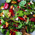 Beet, Lentil and Spinach Salad with Pomegranate Dressing, topped with maple walnuts and crumbled goat cheese.