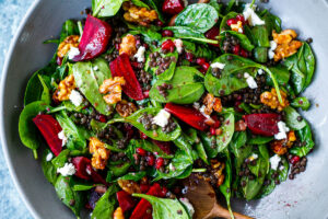 Beet, Lentil and Spinach Salad with Pomegranate Dressing, topped with maple walnuts and crumbled goat cheese. 