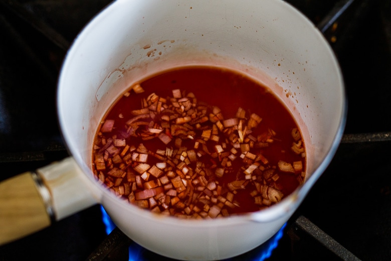 making the pomegranate dressing- reducing pomegranate juice with shallots