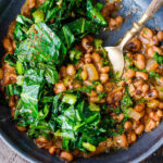 Just in time for New Years Day, here's a tasty, lighter recipe for Smokey Black-Eyed Peas served up with Garlicky Collard Greens and Cornbread- to ensure luck, prosperity and good fortune in the coming year. Vegan and GF.
